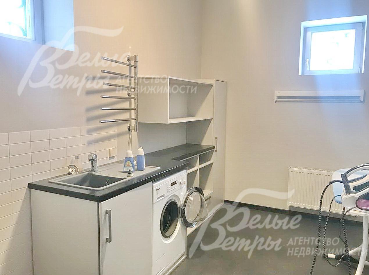 Оборудованная постирочная.